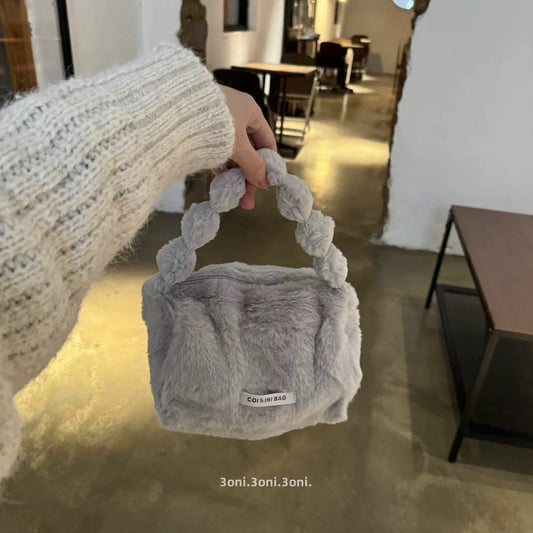 BOLSO DE MANO PELUDO