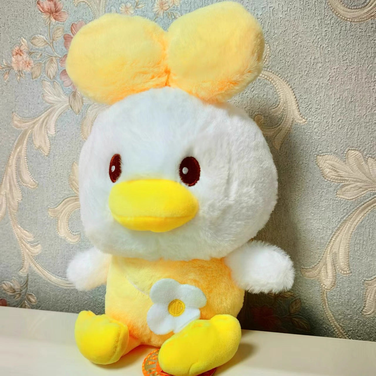 Peluche Pato con flor 22cm